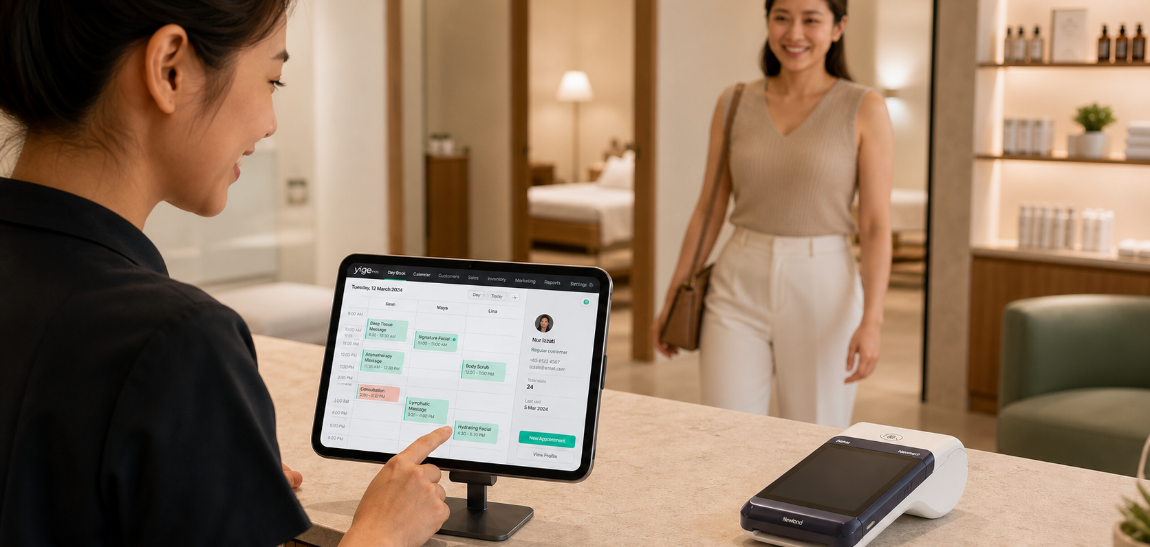 A staff member using the YigePOS appointment calendar on an iPad at reception