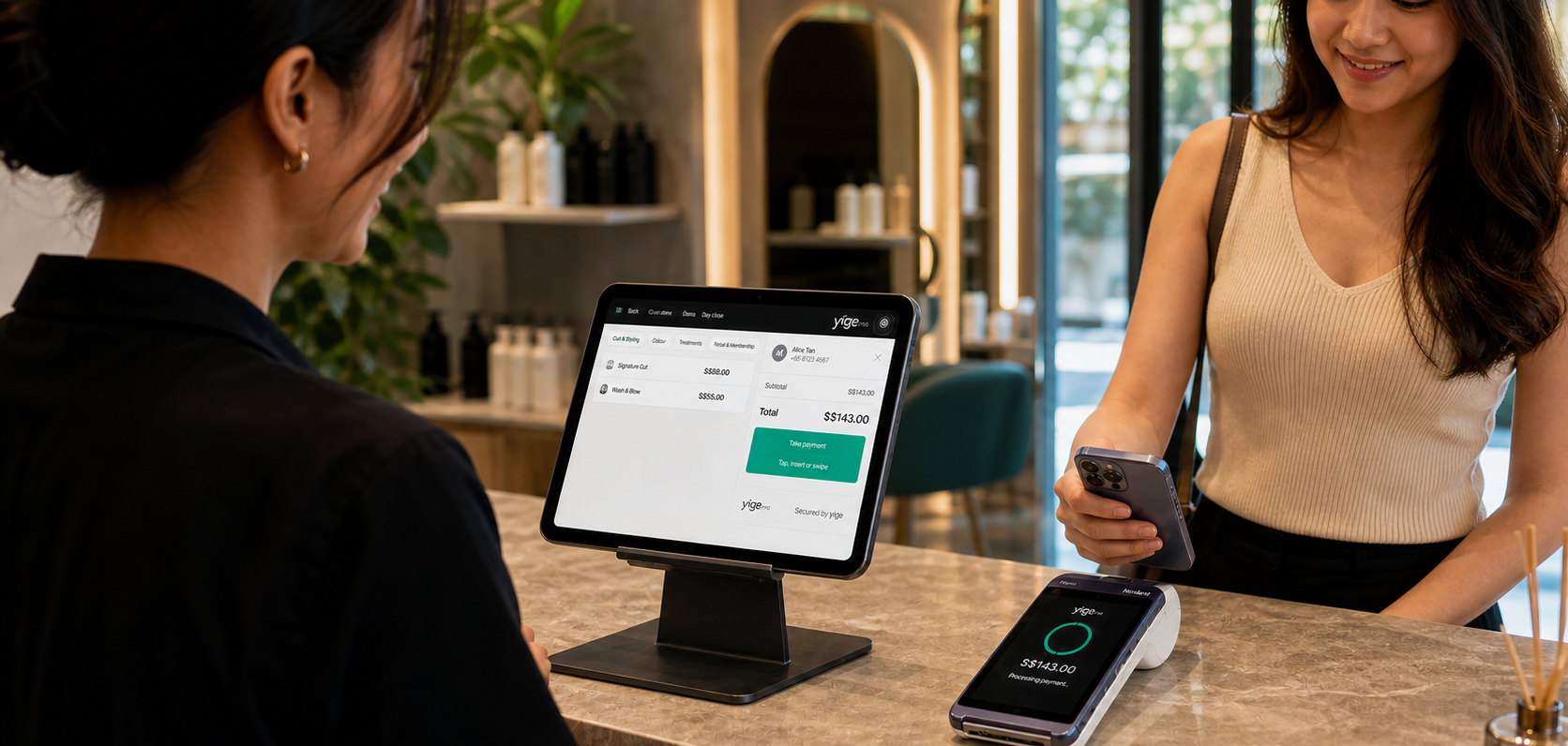 A customer completing a contactless payment while a team member uses YigePOS on a staff-facing iPad